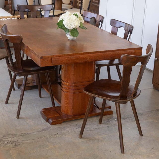 Beautiful set of 8 wood mountain chairs from France, 1950s. Brutalist style with carved wood back with three wide slates....