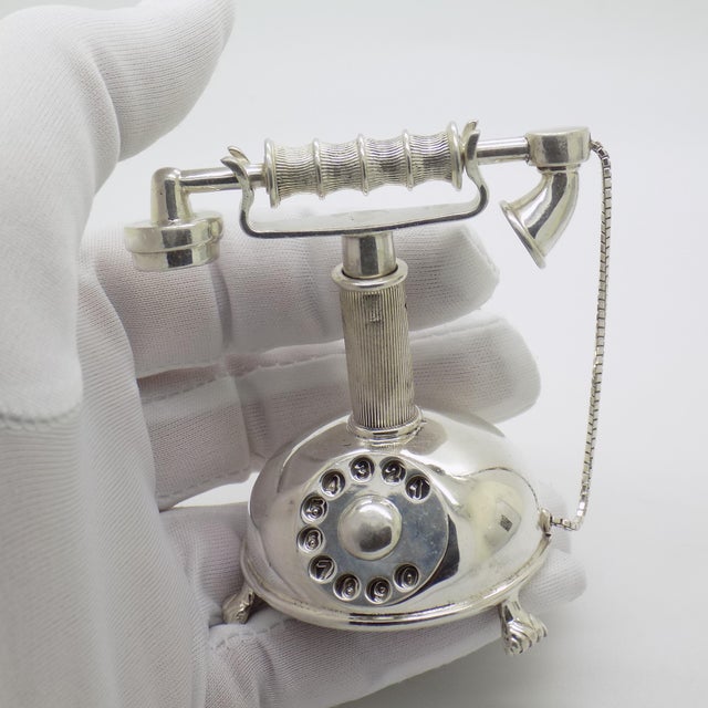 A large solid old phone figurine, handcrafted in Italy during the 1970s to 1980s. This impressive piece is made in genuine...