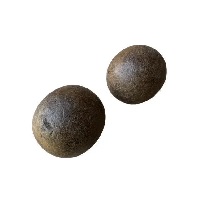 A pair of antique European wood bowling balls — primitive game balls found in Europe. They have nicks and a surface crack;...