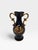 Add a touch of classical French sophistication to your shelves or vanity with this exquisite porcelain miniature urn vase...
