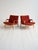 A pair of "Ingrid" armchairs designed by Bruno Mathsson for Dux in the 1960s, featuring a curved and laminated beech wood...