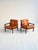 Pair of rosewood and leather armchairs with tufted upholstered seats. "Capella" model by Illum Wikkelsø, Denmark, 1960s....