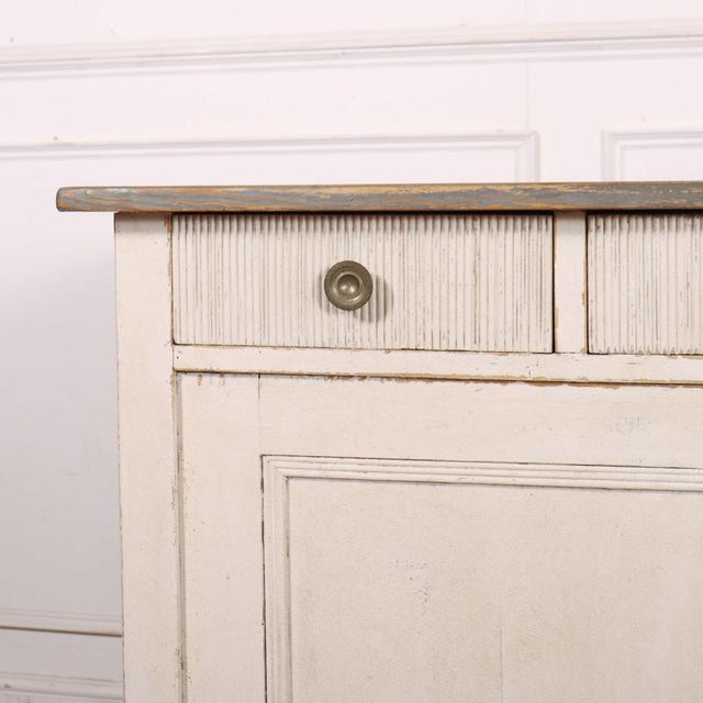 Good 19th C continental painted pine buffet. 1890 This piece is designed in the style of the selected designer and/or...