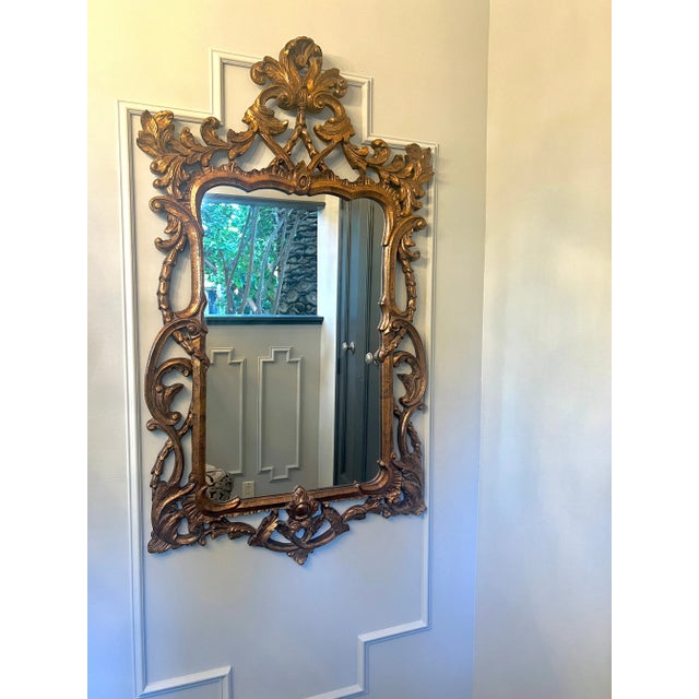 A very Large, 64" tall hand carved Italian Gilt Mirror. The carving is very well done, and in tact with no splits or...