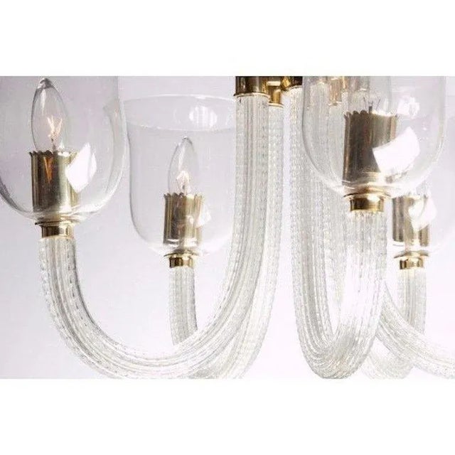 A beautiful and rare example of a 1940s Italian glass chandelier by the famous glass house of Venini. Made of handblown...