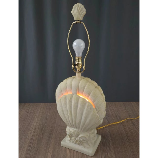 Shell shaped plaster table lamp by Pacific Coast Lighting table lamp. This has a 3-way switch that allows for the main...