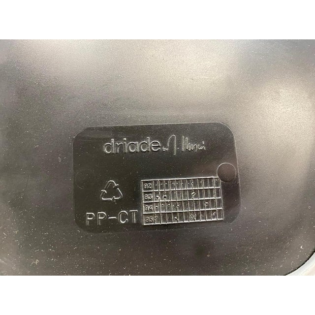 Set of four Silla dining chairs by Joseph Llusca for Driade. Stackable chair with polished aluminum frame, plastic seat...