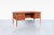 An exceptional example of Swedish modern design, this Model 15 executive desk was designed by Goran Strand for Lelangs...