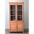 This tall French bibliotheque is perfect for a space needing storage and display. The more recently painted light orange...