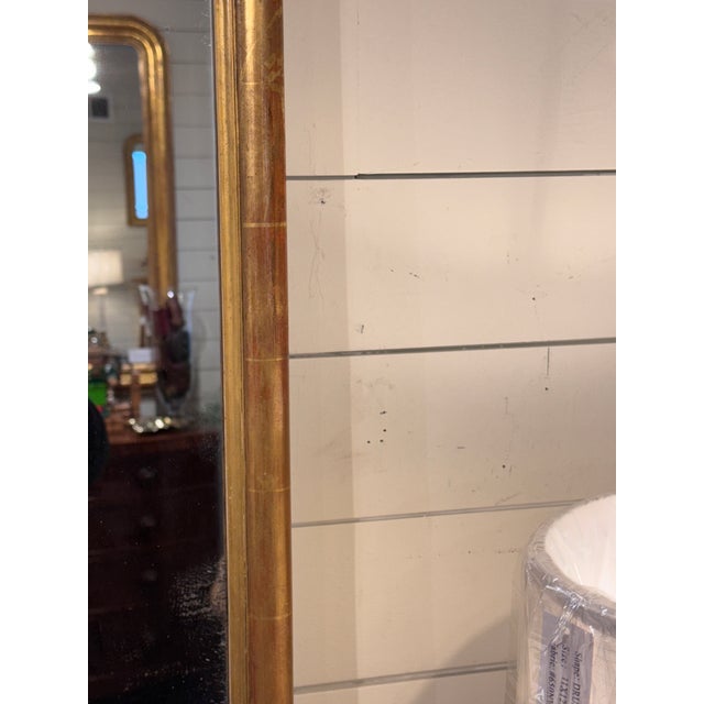 Elegant large scale 19th-century Napoleon III period revival of the style gold gilt mirror. This piece has a beautiful...