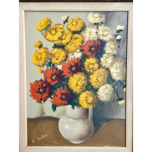 A beautiful floral painting by Ludwig Sohler, presented in an ornate gold gilt frame. Soft, detailed brushwork brings the...