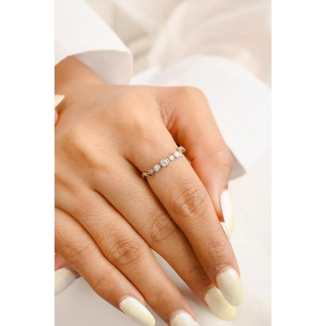 Diamond Wave Band Ring in 18K Gold symbolizes the everlasting love between a couple. It shows the infinite love you have...