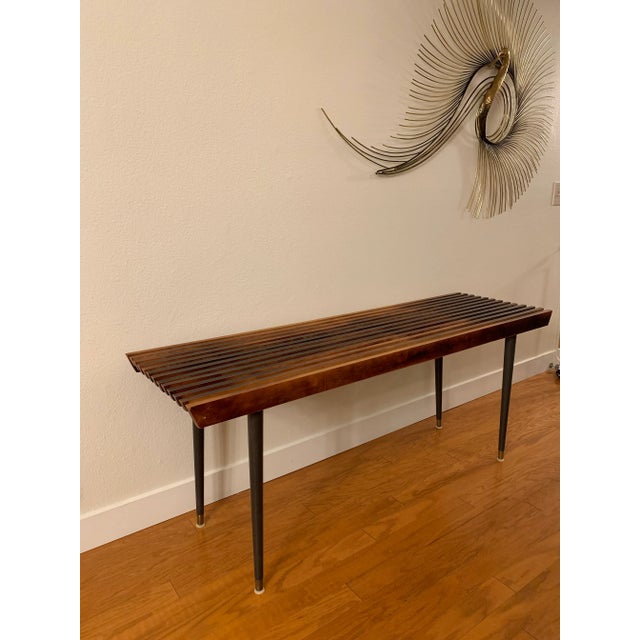Stylish mid-century bench with a wood slat construction, styled after George Nelson. Versatile design able to use for a...