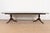 An exceptional Georgian or Regency style double pedestal extension dining table In the manner of Baker Furniture USA,...