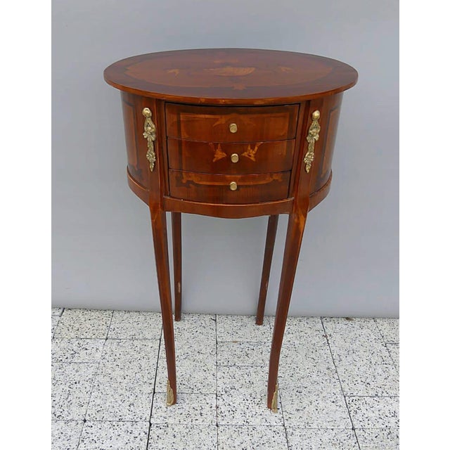 Bring timeless French elegance into your home with this exquisite French Louis XVI round side table, expertly handcrafted...