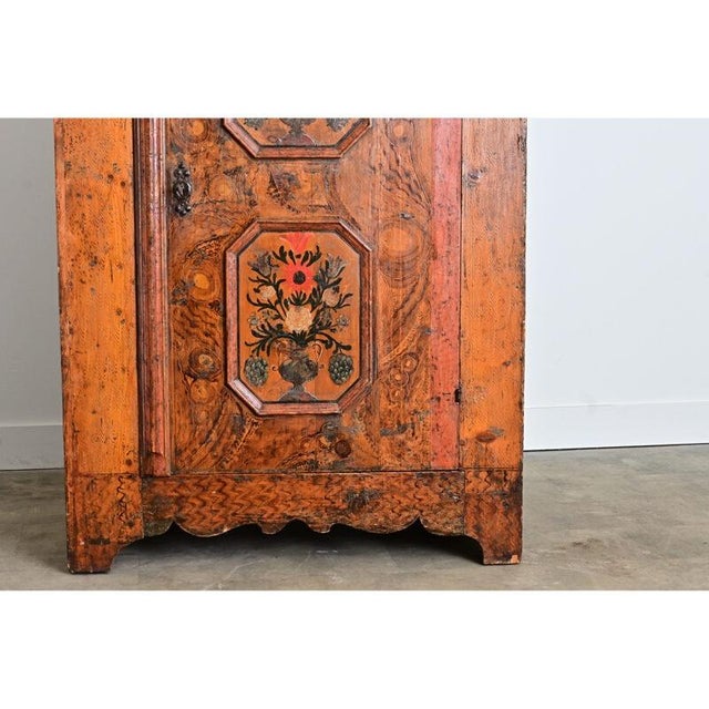 An 18th century painted wardrobe from northern Italy, displaying a particular Tyrolean-Germanic folk art style of marriage...
