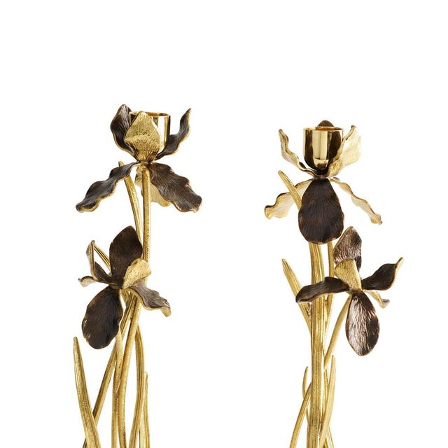 Pair of candlesticks with iris design, gilt metal, patina and marble base. Pair of contemporary candlesticks with iris...