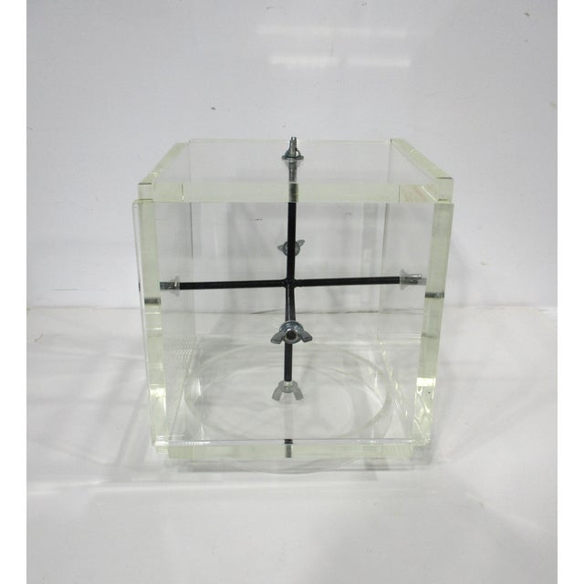 A Lucite thick slab sided box sculpture held together from the inside out with black screws and metal rods . The 2 piece...