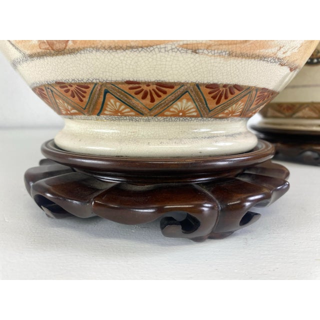 This is a pair of vintage hand painted Satsuma table lamps. These Japanese vases are hand painted with Figurative and...