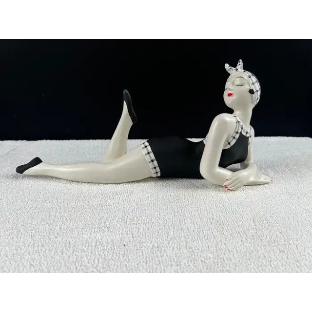 French Style Bathing Beauty Resin Figurine in Black & White Gingham Swimsuit Charming and playful, this French-style...