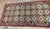 This antique American Hooked carpet is a beautiful testament to late-19th-century North American textile craftsmanship....