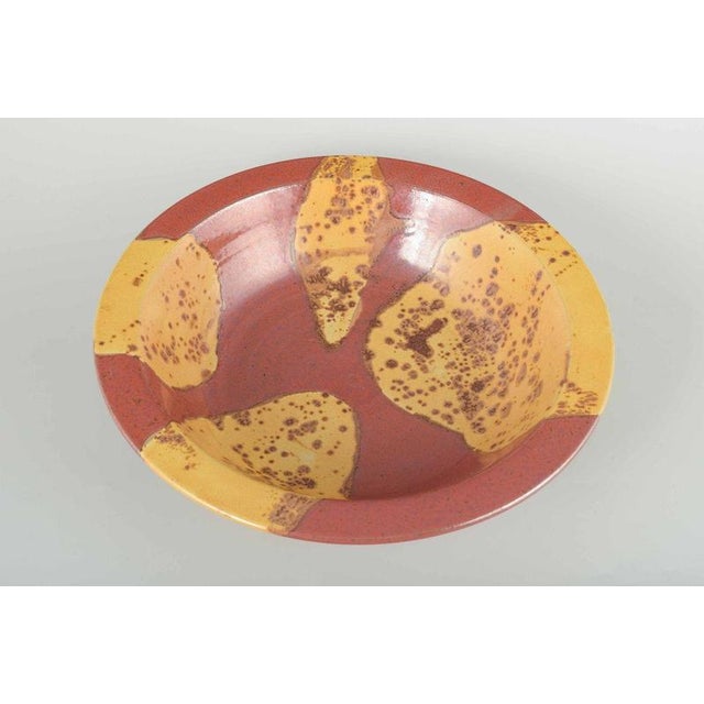 Scandinavian Studio Potter Large bowl, ca. 1980s. Wheel-thrown stoneware bowl with reddish-brown base glaze and decorative...