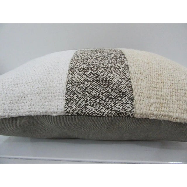 This is a pillow cover made from a vintage kilim rug. The piece was properly washed and ready to use. Pillow inserts not...