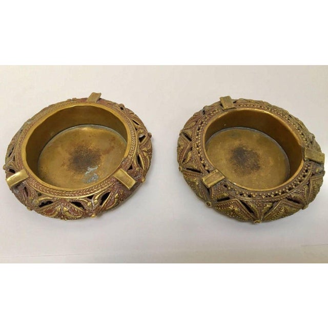 Pair of Anglo-Indian Cast Brass Ashtrays — Dhokra Tribal Bracelet Form A distinctive pair of handcrafted cast brass...