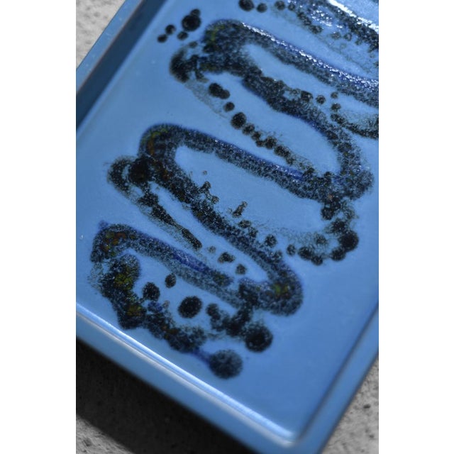This extraordinary ceramic tray was made in Sweden during the 1960s. Made of high-quality glazed ceramic in shades of...