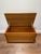 A beautifully minimalist Danish Modern teak blanket chest or storage trunk, showcasing the clean lines and refined...