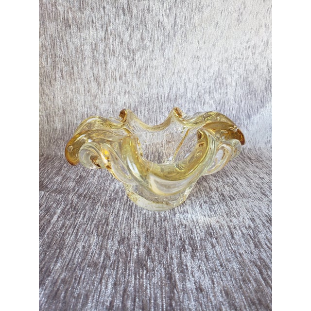 Offering a gorgeous Murano glass bowl most likely made by Barovier & Toso, circa 1950s. This bowl has a lovely yellow...