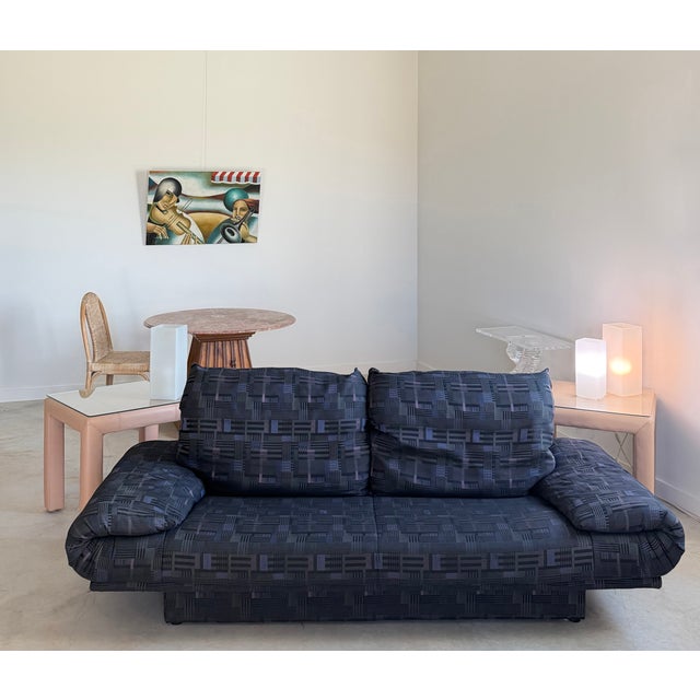 A Rolf Benz "345" lounge Postmodern sofa with comfortable, wide arms and inset plinth base. This three person sofa retains...