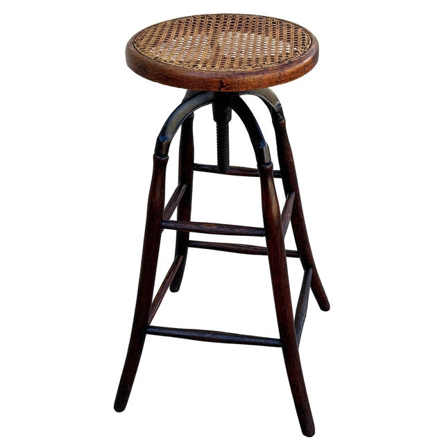 Late Victorian four legged adjustable oak and iron drafting/workshop adjustable stool by Thonet. The base structure is...
