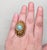1960s goldtone ribbed domed with faux-turquoise center with studs around the stone and around the outside edges adjustable...