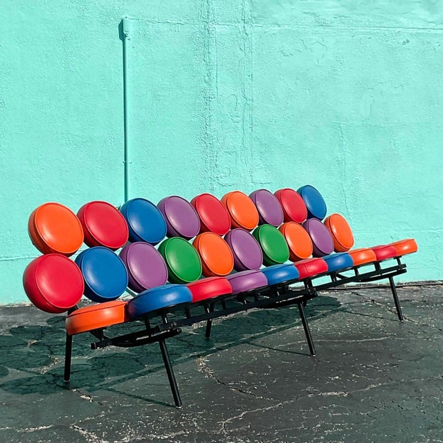 A fabulous vintage MCM sofa. The iconic Marshmallow sofa in an extra long length. Done in the manner of Irving Harper for...