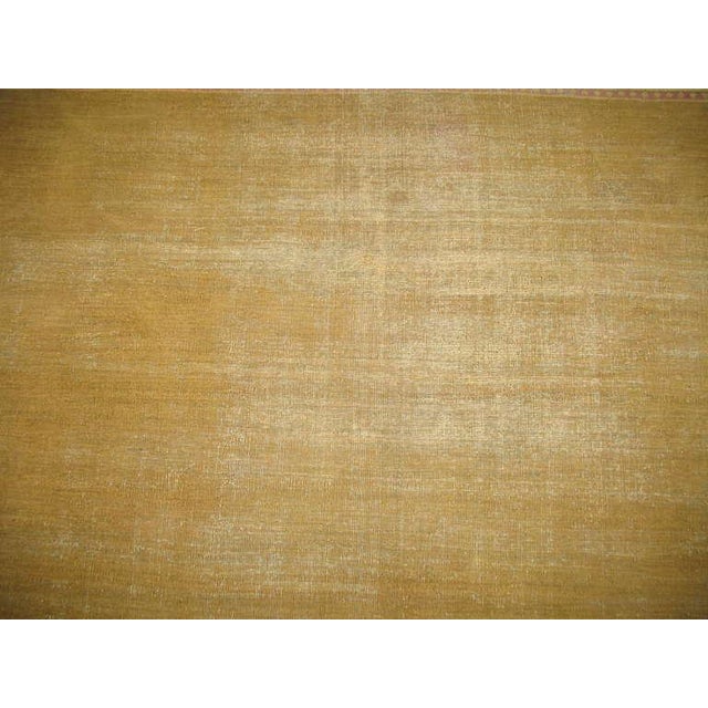 A late 19th century antique Indian Amritsar with a open pistachio field design surrounded by a pink and ivory border.