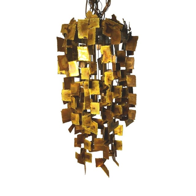 Magnificent tiered chandelier by Tom Greene for Feldman circa 1960s. It has original patina and has been preserved in...