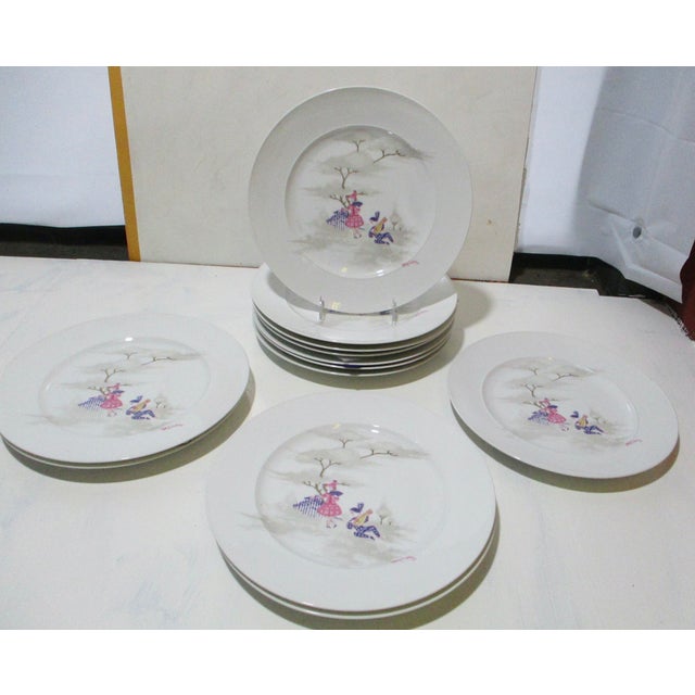 Rosenthal Bjorn Wiinblad Set of 12 dinner plates measuring 11" in diameter. In a retelling of Pirot and Pirette, the...