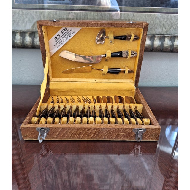 Presenting a unique mid-century dessert set in brass and onyx tone. Includes 8 spoons, 8 forks, a small serving spoon,...