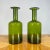 Handsome pair of Gulvvase glass vases designed by Otto Brauer for Holmgaard. The iconic bottle shaped vases were designed...