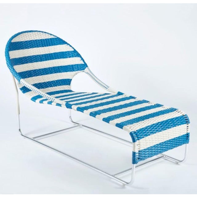Woven chaise with hooped back and open sides updated for the outdoors. Available in natural, white-colored or in blue-...