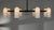 Spokes of brass hold slender lampshades, the circle of light creating a planetary effect in this striking round...
