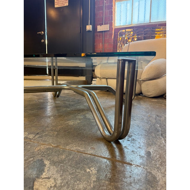 Designed by Gianfranco Frattini for Cassina, coffee table model 784 with chromed steel frame and glass top. This is the...
