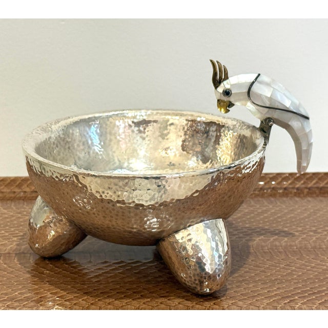 hammered silver over copper molcajete bowl made by Los Castillo in Taxco, Guerrero, Mexico, circa 1960's. Featuring a...