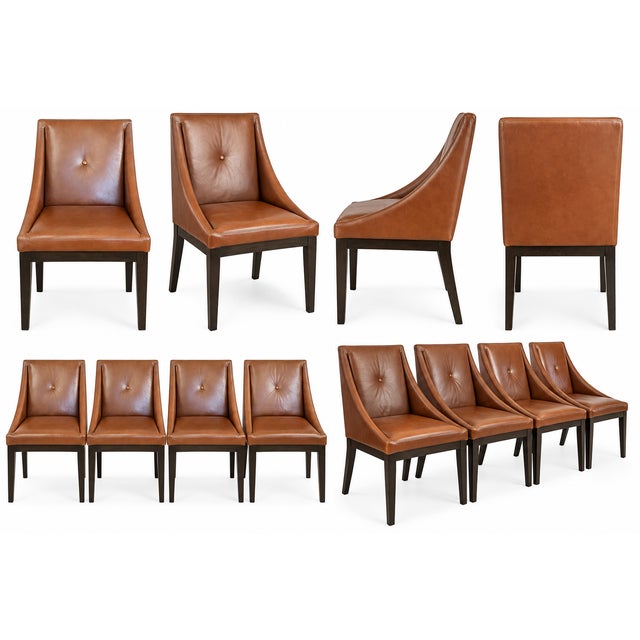 Beautiful set of 8 cognac brown leather dining chairs with black wood legs. Chairs feature a single button-tufted back,...