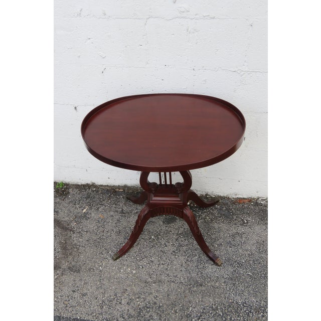 This beautiful Side Table is made of wood, mahogany, and veneer. This gorgeous end table feature Traditional style, oval...