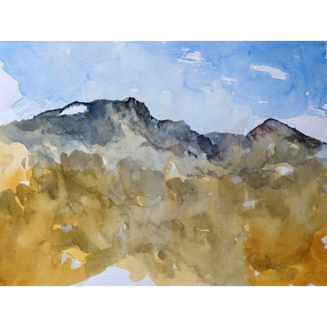 This watercolor depicts the rugged peaks of the Gore Range, capturing the interplay of light and shadow across the...