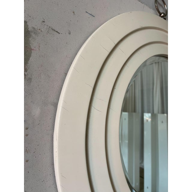 A beautifully proportioned Italian wall mirror defined by its bold, concentric frame and soft architectural presence. The...