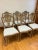 A beautiful set of six Sheraton style dining side chairs in a gorgeous distressed painted finish. The shield backs...