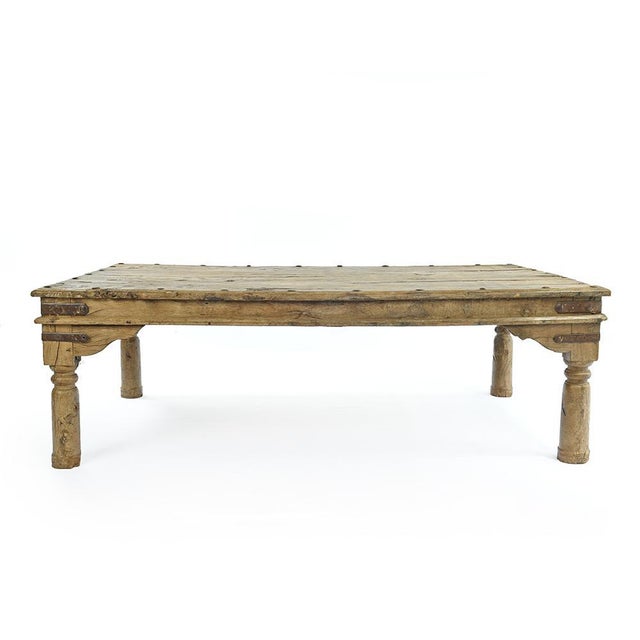 Indian long wooden table studded This piece is designed in the style of the selected designer and/or manufacturer